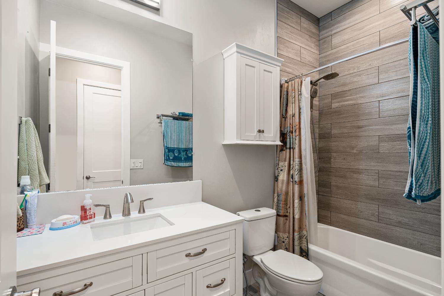 3629 Chelsea Road Cameron Park, CA 95682 - Photo 18 of 44 a bathroom with a sink a toilet and shower