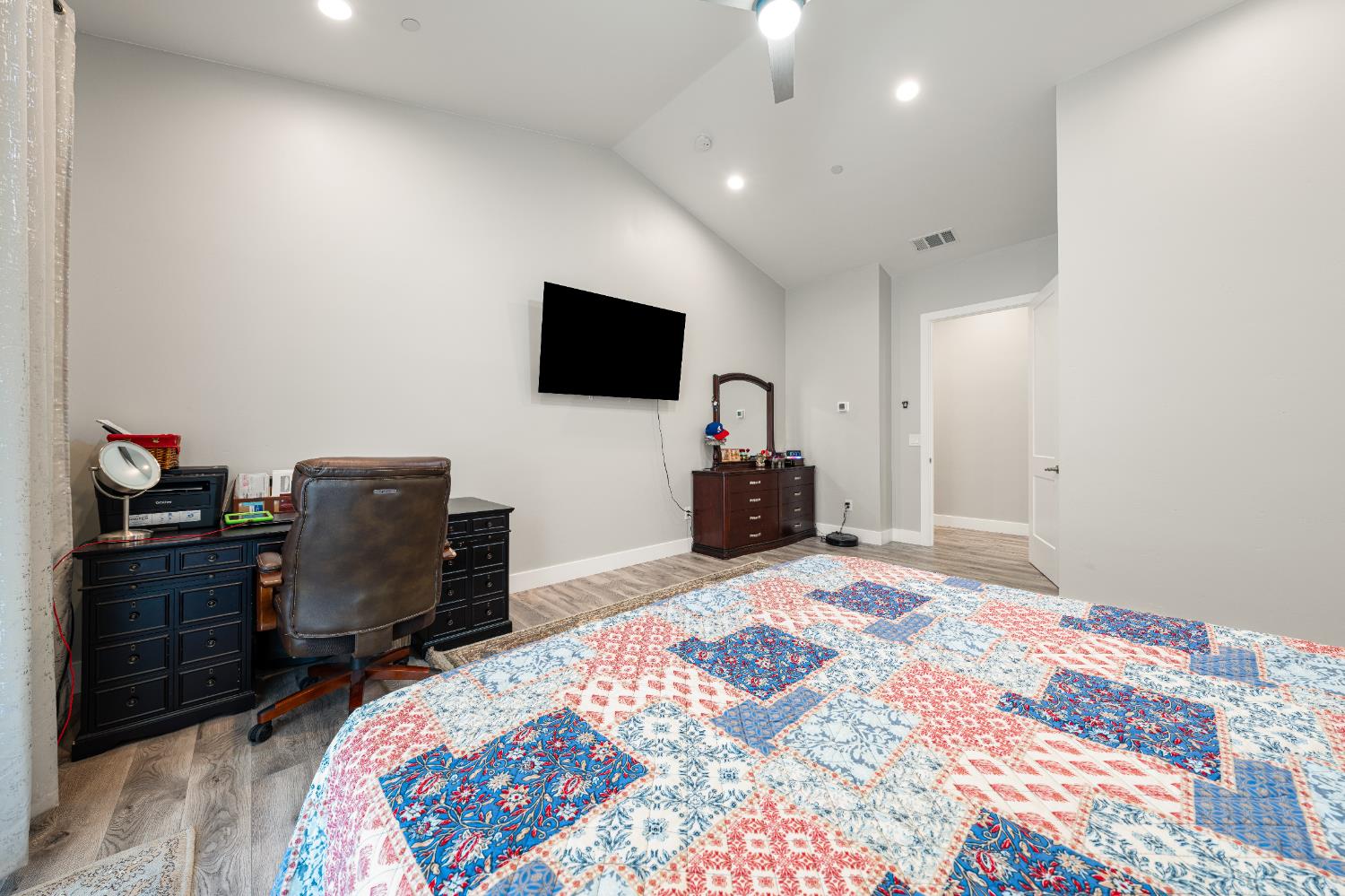 3629 Chelsea Road Cameron Park, CA 95682 - Photo 21 of 44 a bedroom with a bed and a flat screen tv