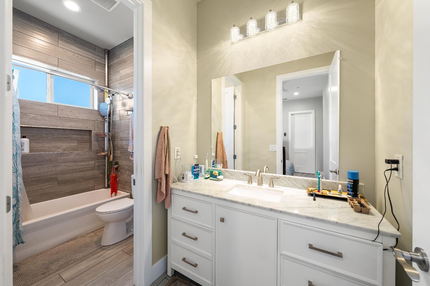 3629 Chelsea Road Cameron Park, CA 95682 - Photo 31 of 44 a bathroom with a double vanity sink toilet and shower