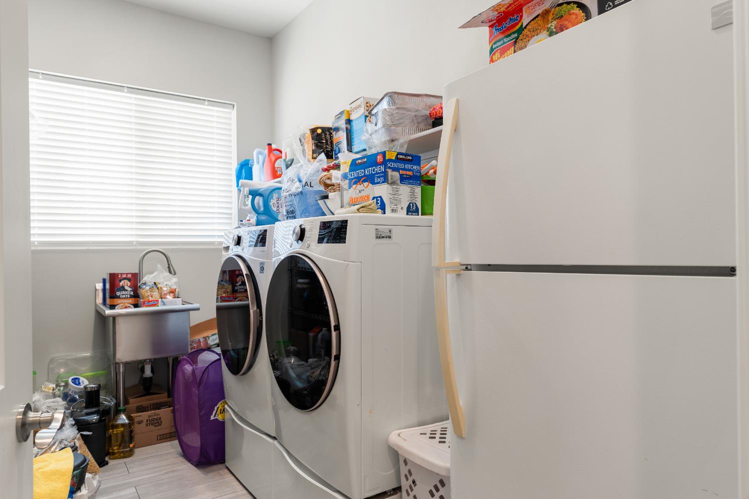 3629 Chelsea Road Cameron Park, CA 95682 - Photo 32 of 44 a utility room with dryer washer and a view of living room