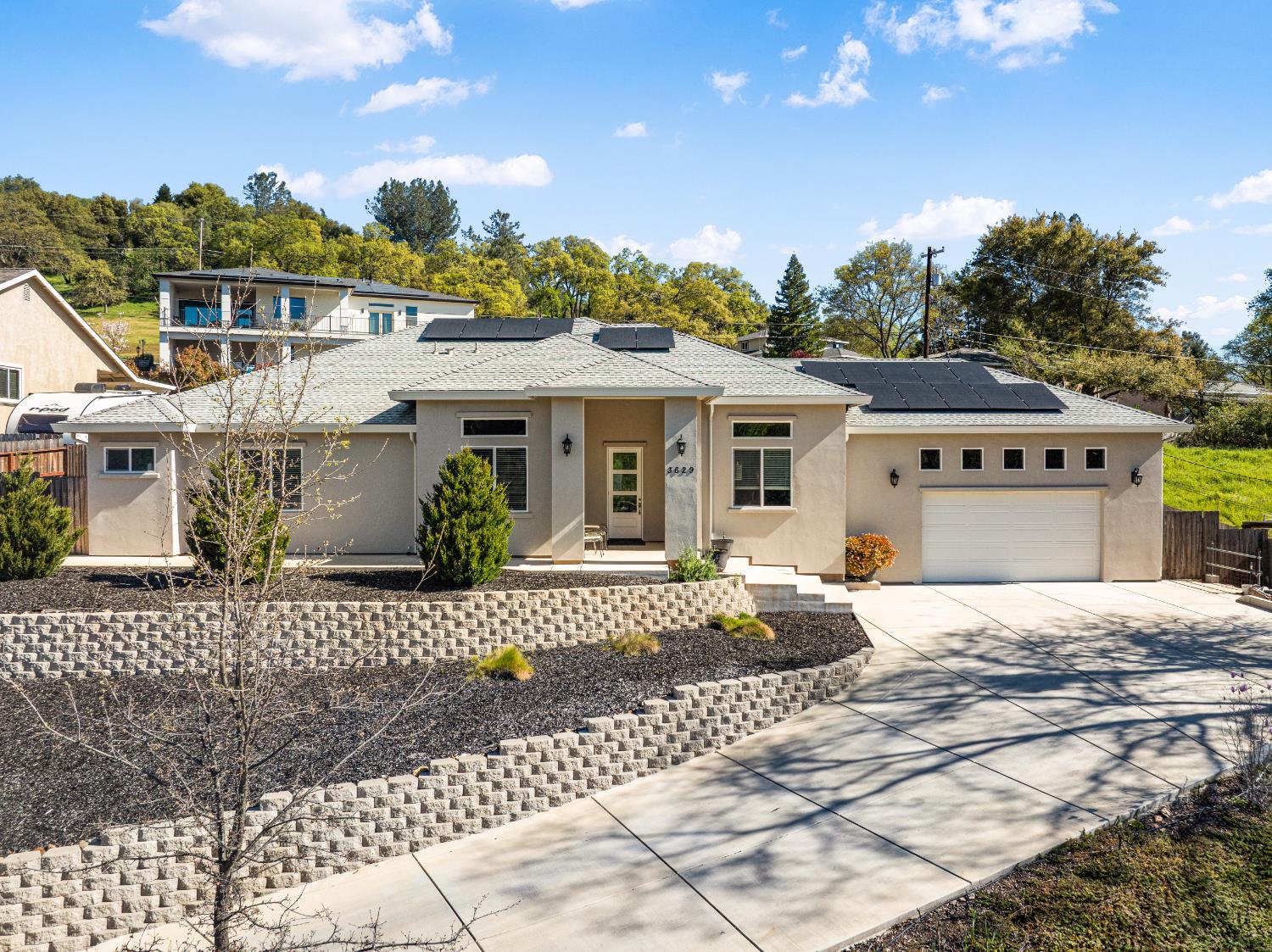 3629 Chelsea Road Cameron Park, CA 95682 - Photo 39 of 44 a front view of a house with a garden and entryway