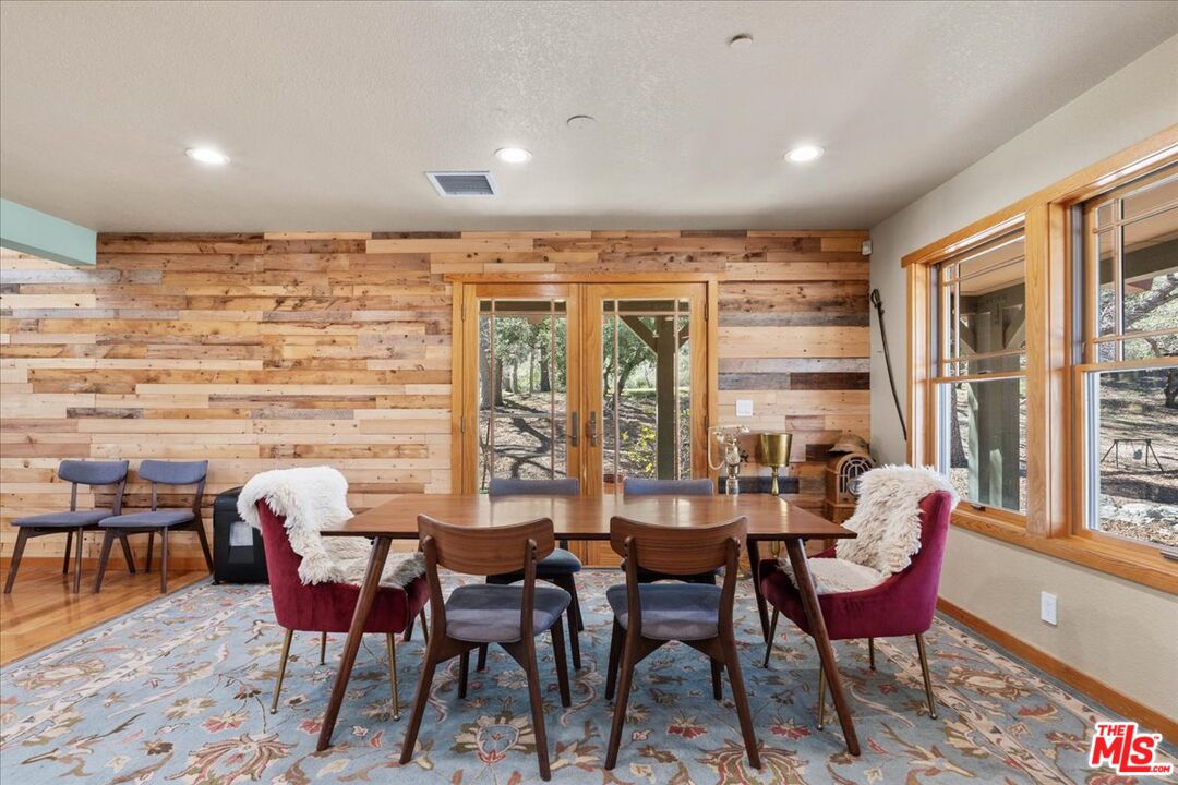 28200 Pine Canyon Road Lake Hughes, CA 93532 - Photo 15 of 52 a view of a dining room with furniture window and outside view