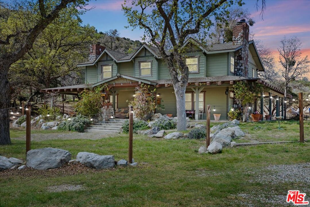 28200 Pine Canyon Road Lake Hughes, CA 93532 - Photo 2 of 52 a front view of a house with a yard