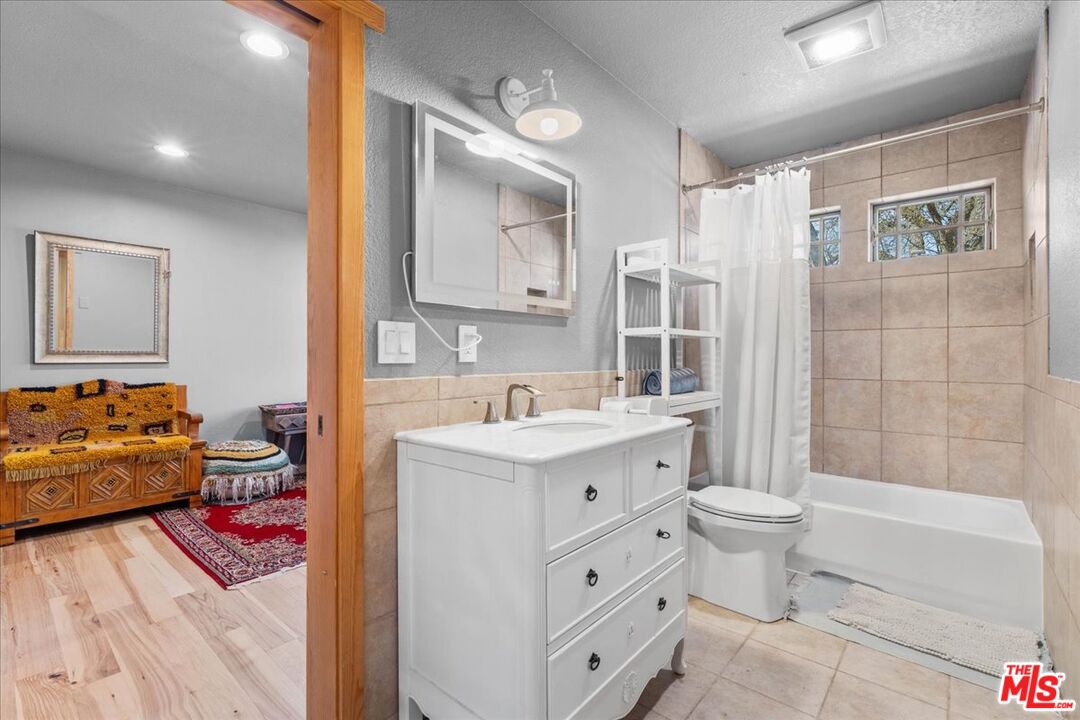 28200 Pine Canyon Road Lake Hughes, CA 93532 - Photo 24 of 52 a bathroom with a sink toilet and shower