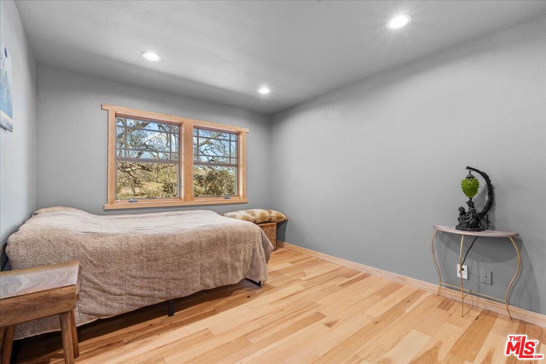 28200 Pine Canyon Road Lake Hughes, CA 93532 - Photo 26 of 52 a bedroom with a bed and window
