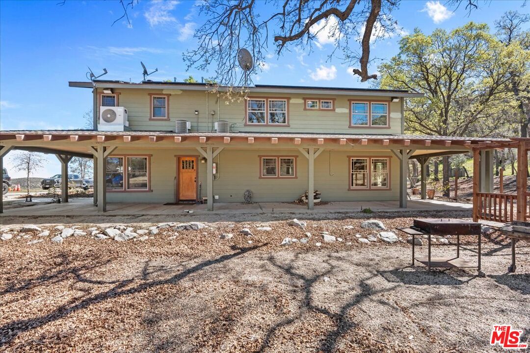 28200 Pine Canyon Road Lake Hughes, CA 93532 - Photo 37 of 52 a front view of a house with a yard