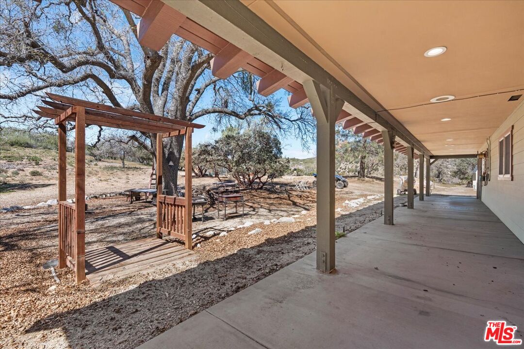 28200 Pine Canyon Road Lake Hughes, CA 93532 - Photo 39 of 52 a view of a porch with a bench