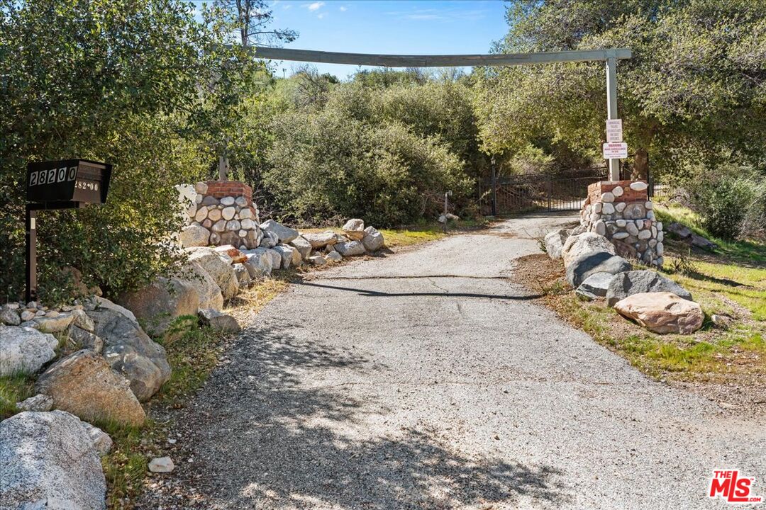28200 Pine Canyon Road Lake Hughes, CA 93532 - Photo 41 of 52 a view of a yard with an outdoor space