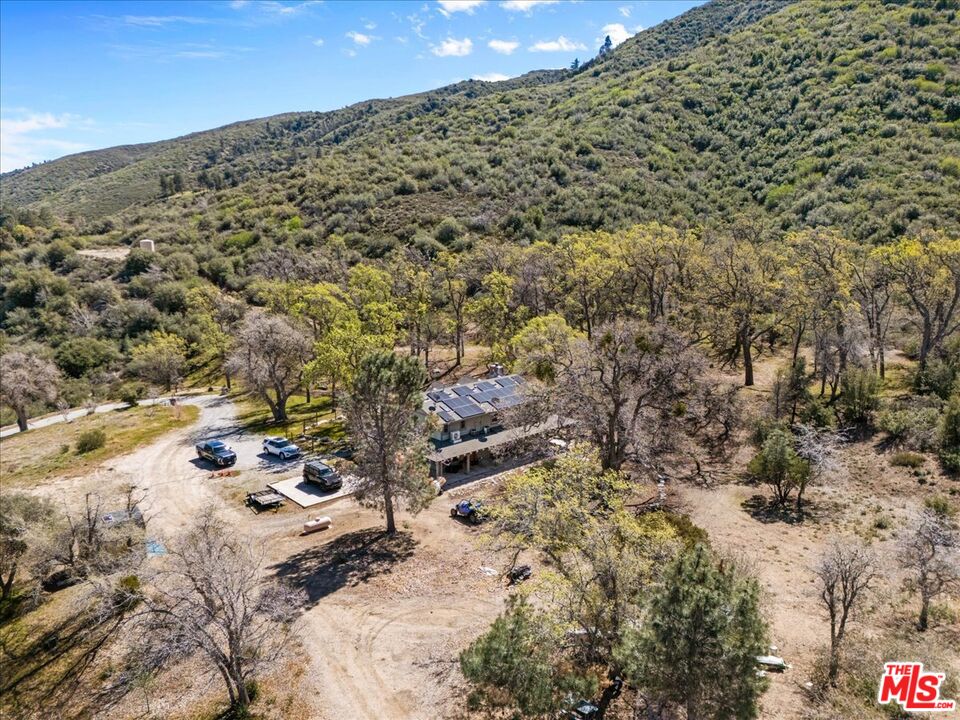 28200 Pine Canyon Road Lake Hughes, CA 93532 - Photo 43 of 52 a view of a large building with a yard