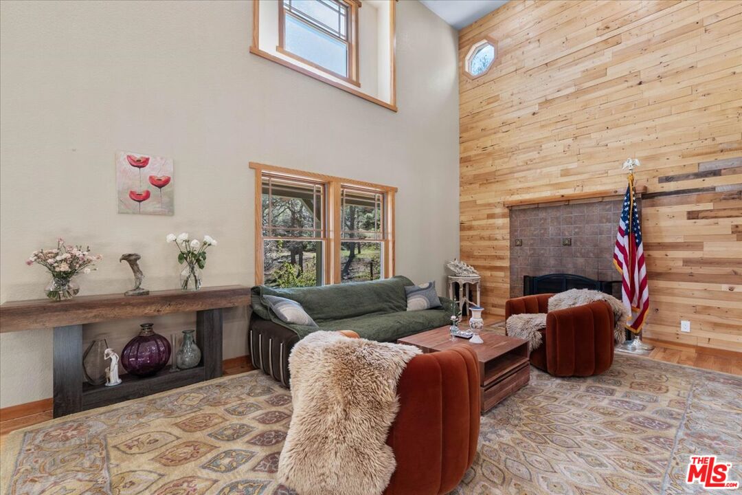 28200 Pine Canyon Road Lake Hughes, CA 93532 - Photo 7 of 52 a living room with furniture and a fireplace