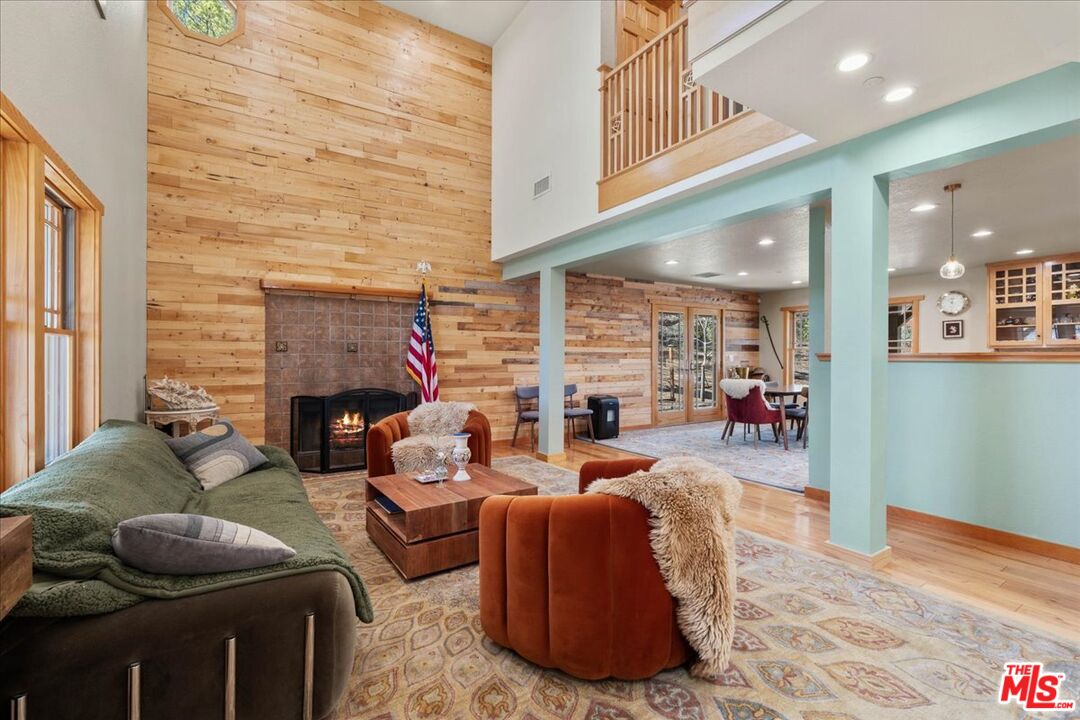 28200 Pine Canyon Road Lake Hughes, CA 93532 - Photo 8 of 52 a living room with furniture and a fireplace