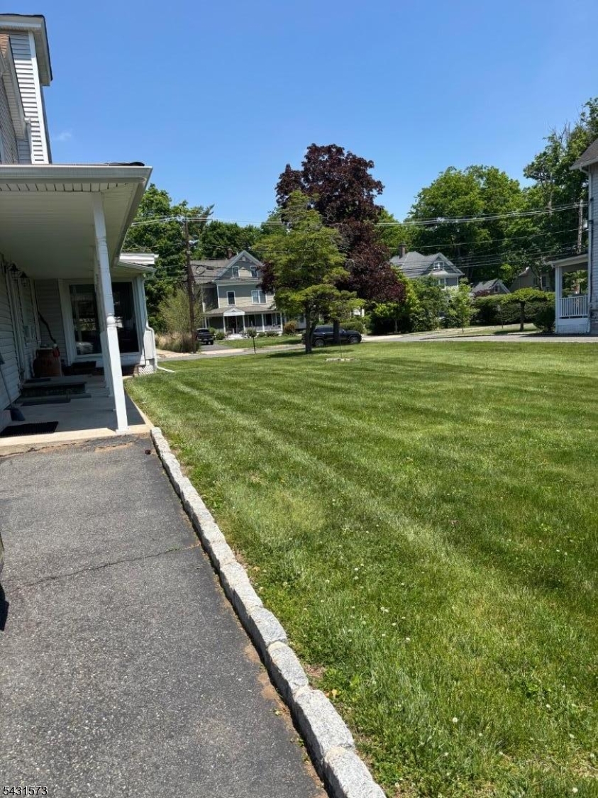 358 Woodland Road, Unit 2 Madison, NJ 07940 - Photo 45 of 50 a view of a house with a yard