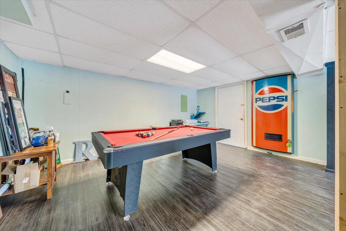 4644 Desi Road Northwest Roanoke, VA 24017 - Photo 16 of 24 a room with pool table wooden floor and window