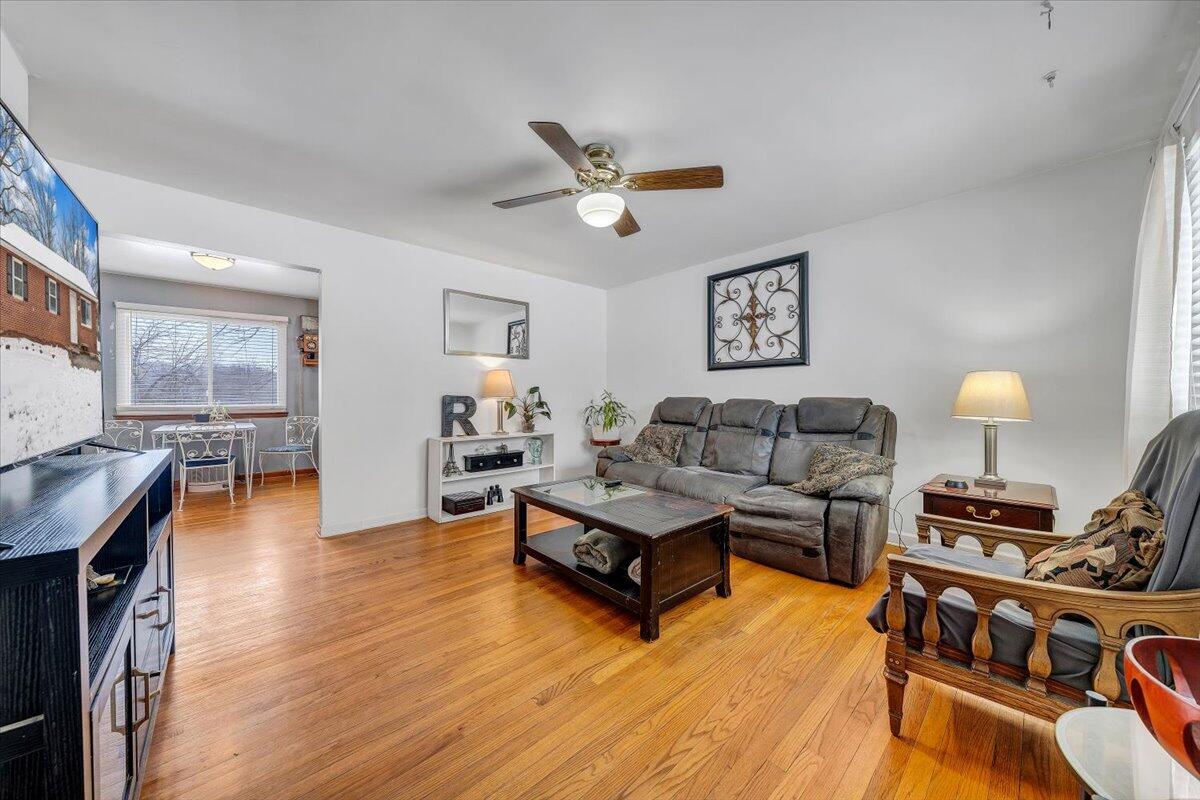 4644 Desi Road Northwest Roanoke, VA 24017 - Photo 4 of 24 a living room with furniture and a wooden floor