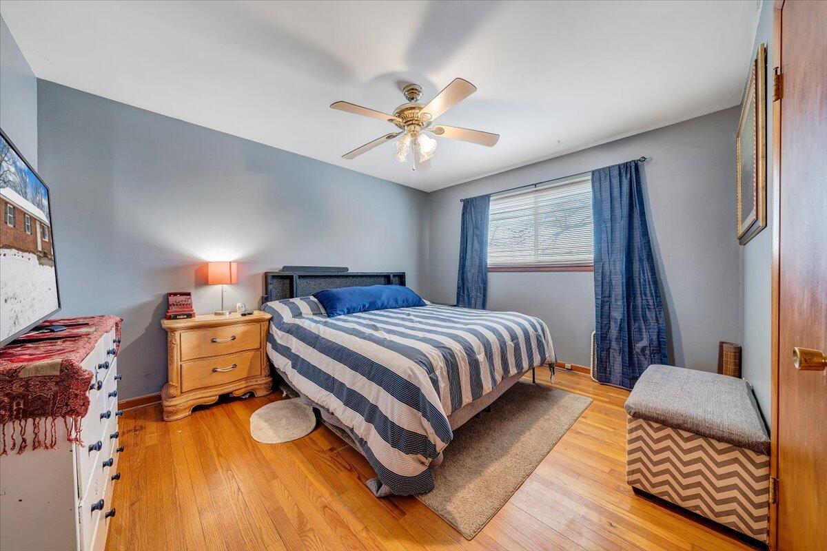 4644 Desi Road Northwest Roanoke, VA 24017 - Photo 9 of 24 a bedroom with a bed and wooden floor