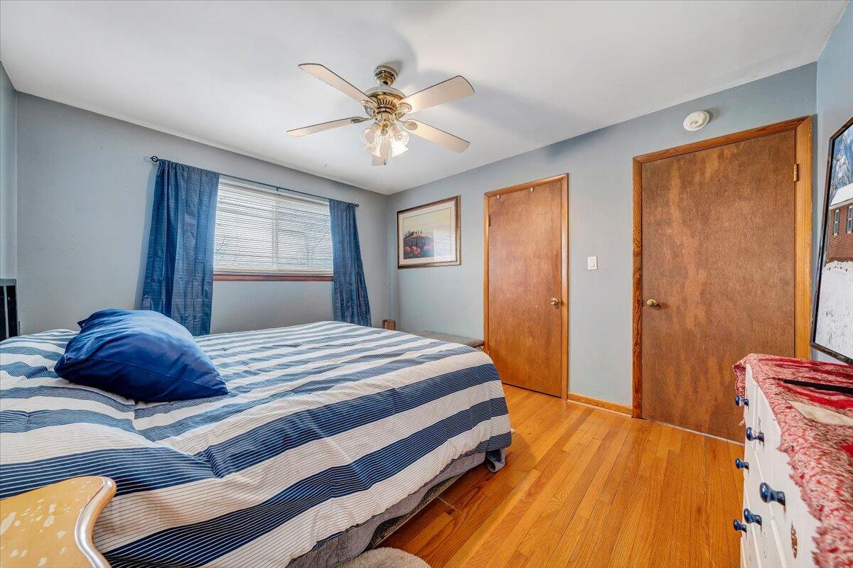 4644 Desi Road Northwest Roanoke, VA 24017 - Photo 10 of 24 a bedroom with a bed and wooden floor