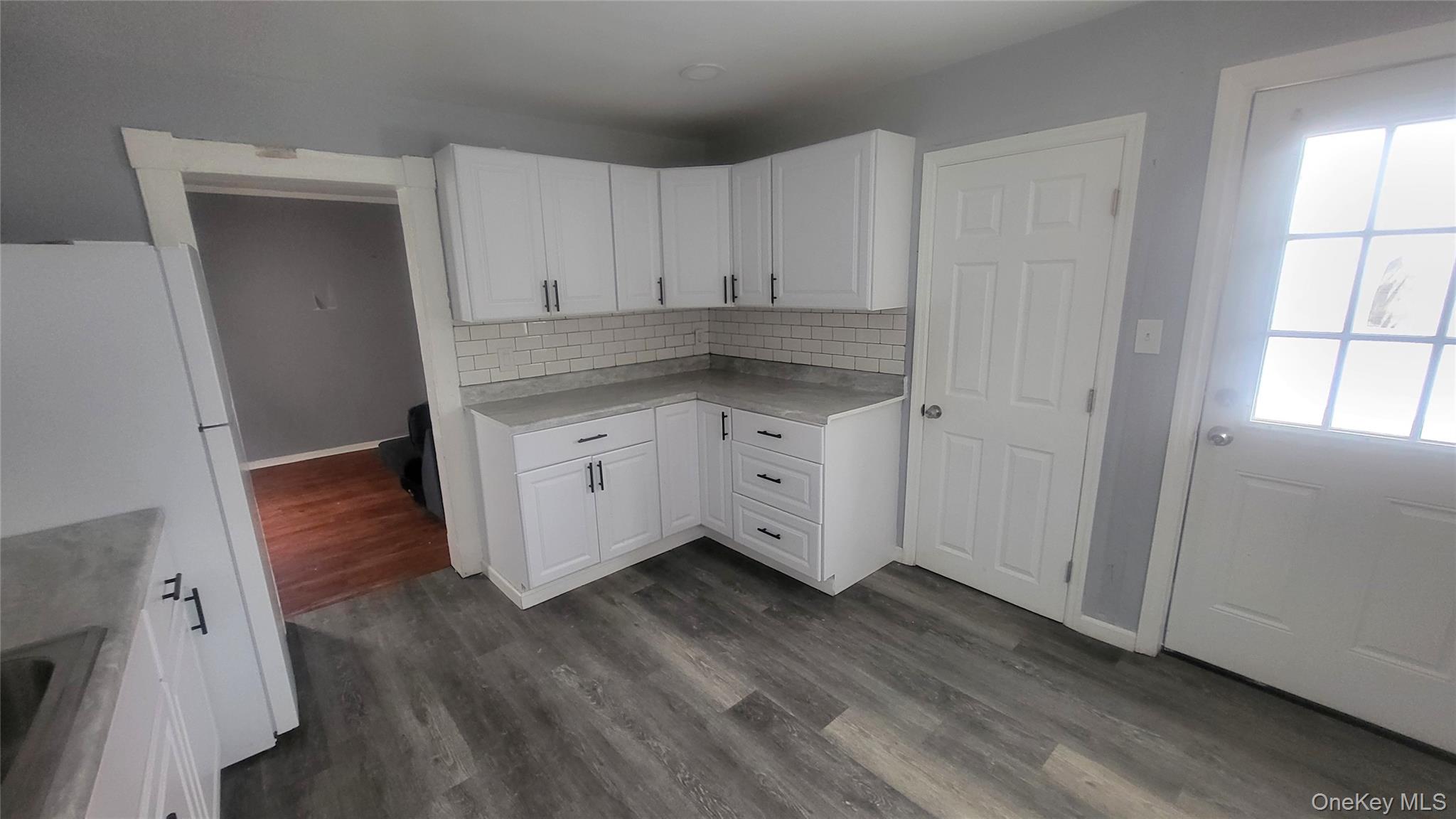 164 Thompson Street Poughkeepsie, NY 12601 - Photo 4 of 17 Kitchen offers new engineered wood floor