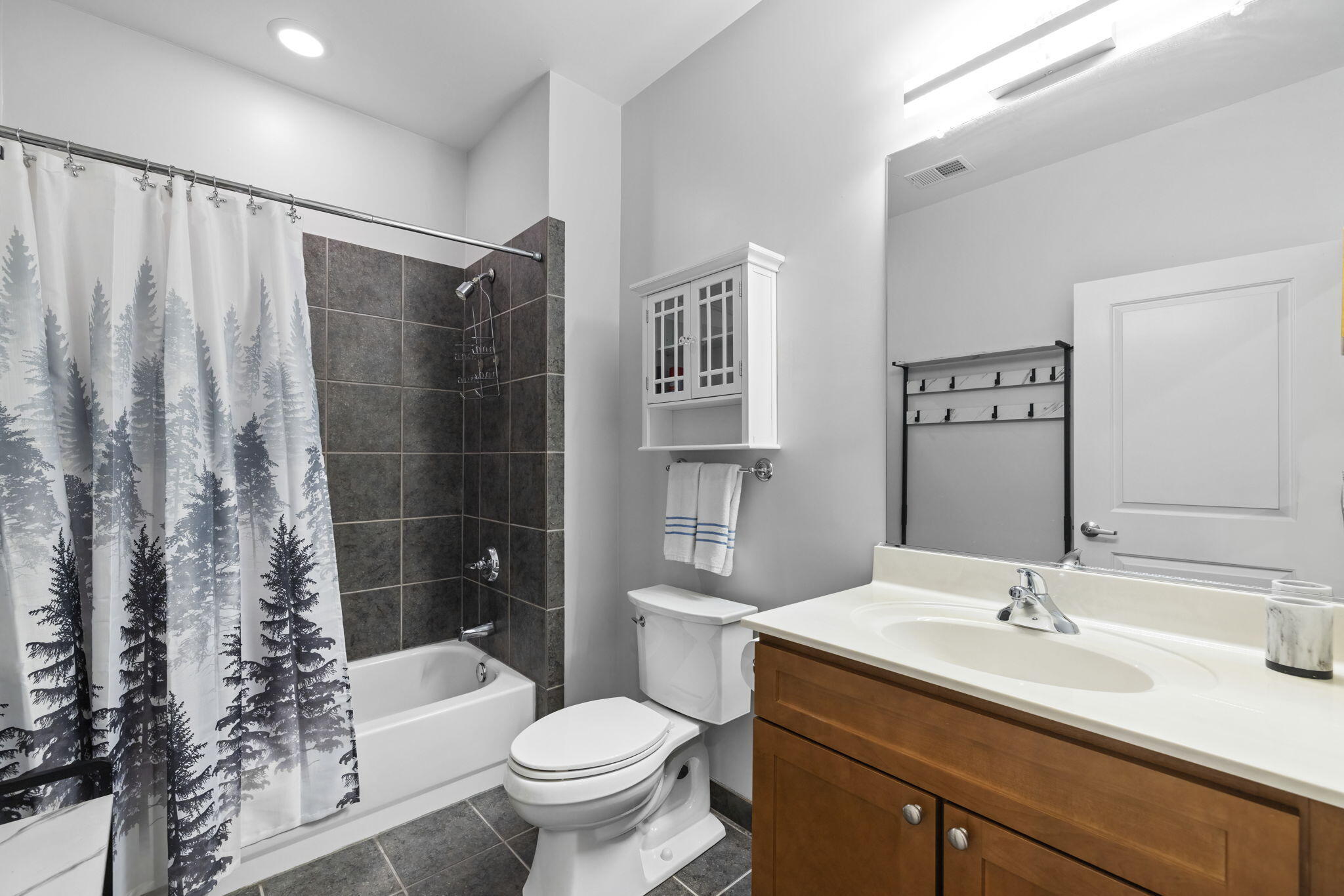 71 Timber Trail Michigan City, IN 46360 - Photo 20 of 27 a bathroom with a sink toilet a mirror and shower