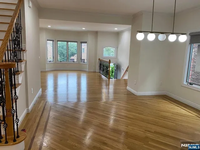 a view of an entryway with wooden floor