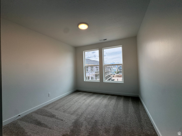1876 West 1575th North, Unit 237 Layton, UT 84041 - Photo 11 of 20 Empty room with carpet flooring and baseboards