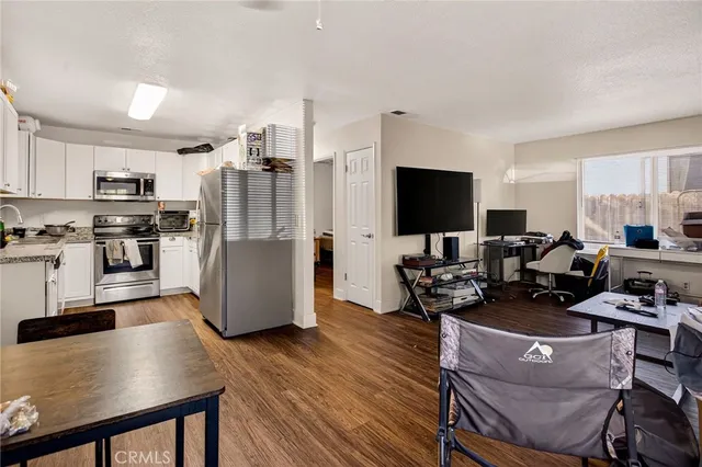 a kitchen with a refrigerator sink and microwave