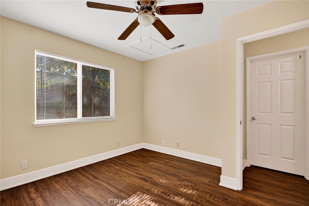 703 West 2nd Avenue Chico, CA 95926 - Photo 17 of 27 a view of empty room with wooden floor and fan