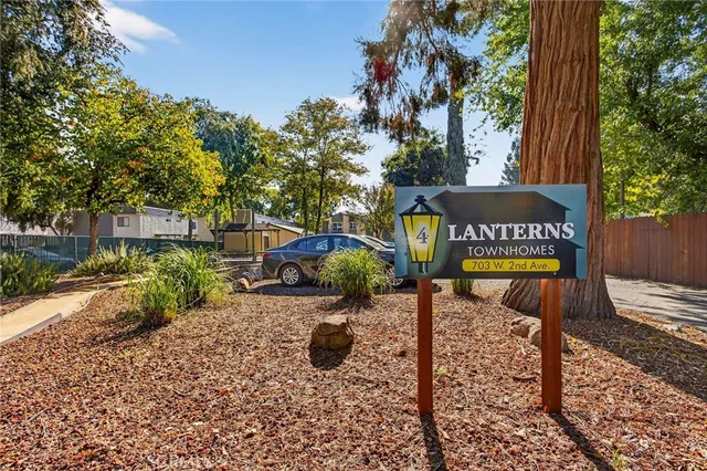 a view of a park with iron fence