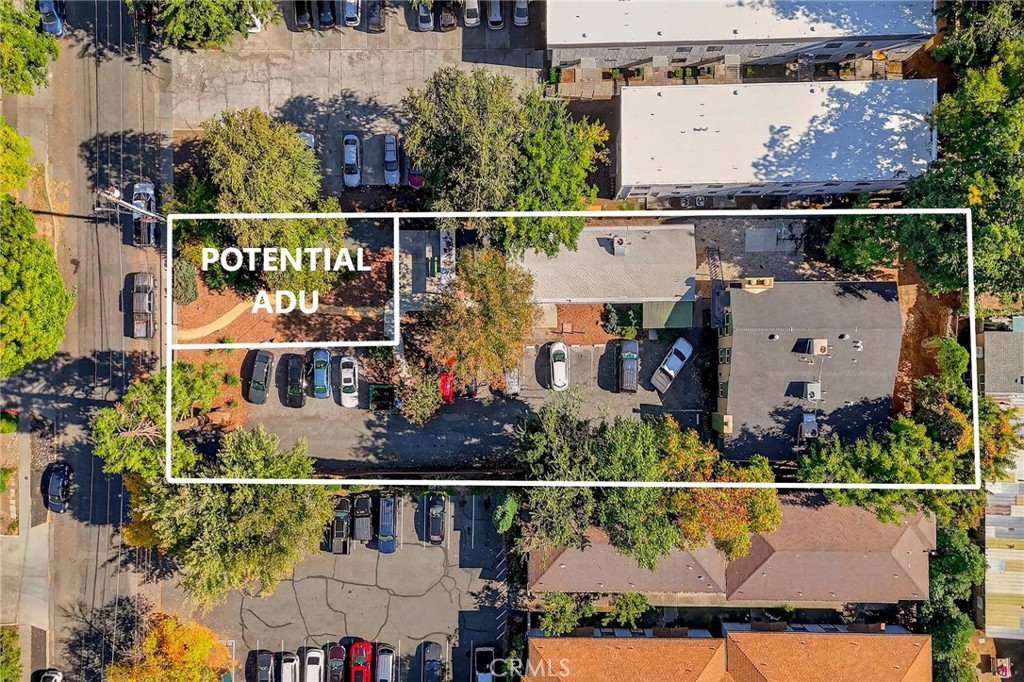 703 West 2nd Avenue Chico, CA 95926 - Photo 3 of 27 an aerial view of water with lots of trees and buildings
