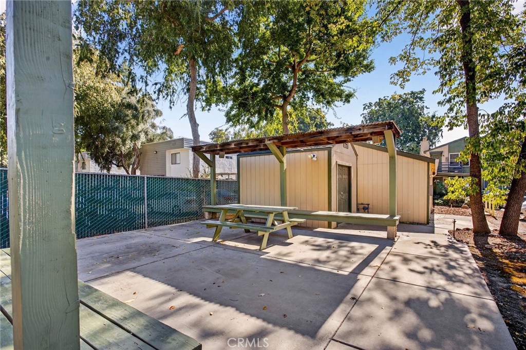 703 West 2nd Avenue Chico, CA 95926 - Photo 9 of 27 a backyard of a house with table and chairs