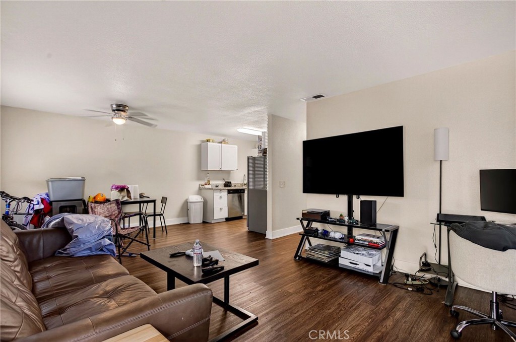 703 West 2nd Avenue Chico, CA 95926 - Photo 10 of 27 a living room with furniture and a flat screen tv