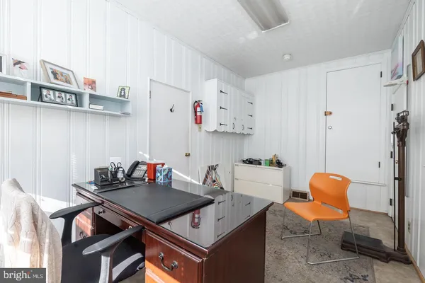a kitchen with stainless steel appliances a refrigerator sink and cabinets