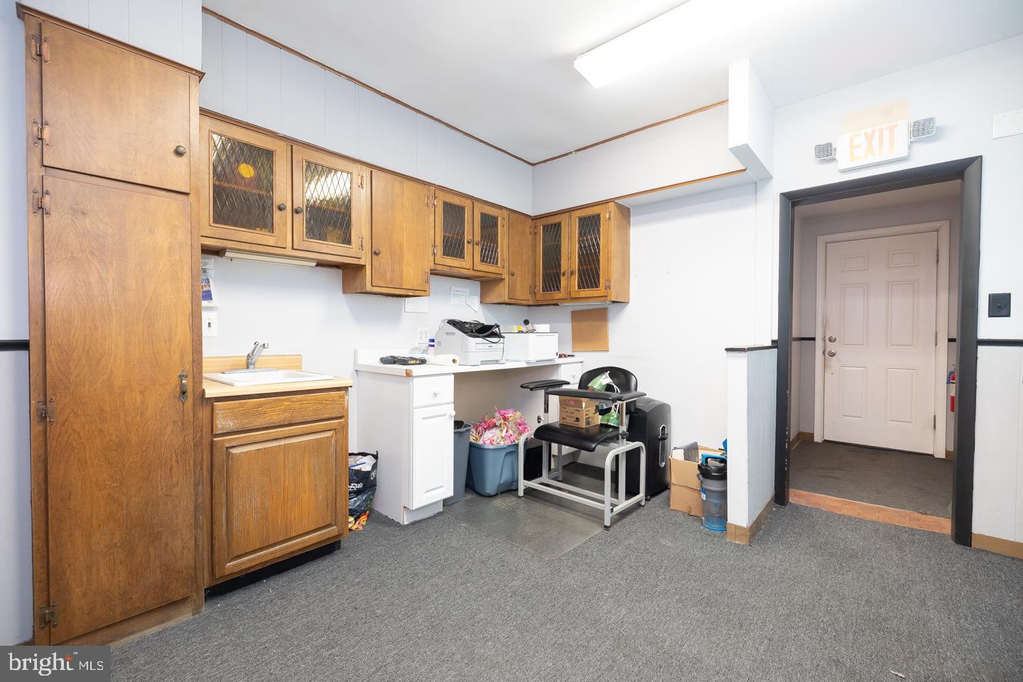 1017 Market Street Gloucester City, NJ 08030 - Photo 19 of 40 a kitchen with stainless steel appliances a refrigerator sink and cabinets