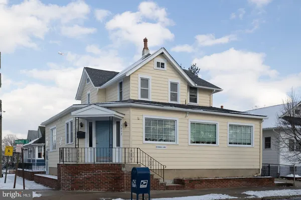 a front view of a house with a barbeque
