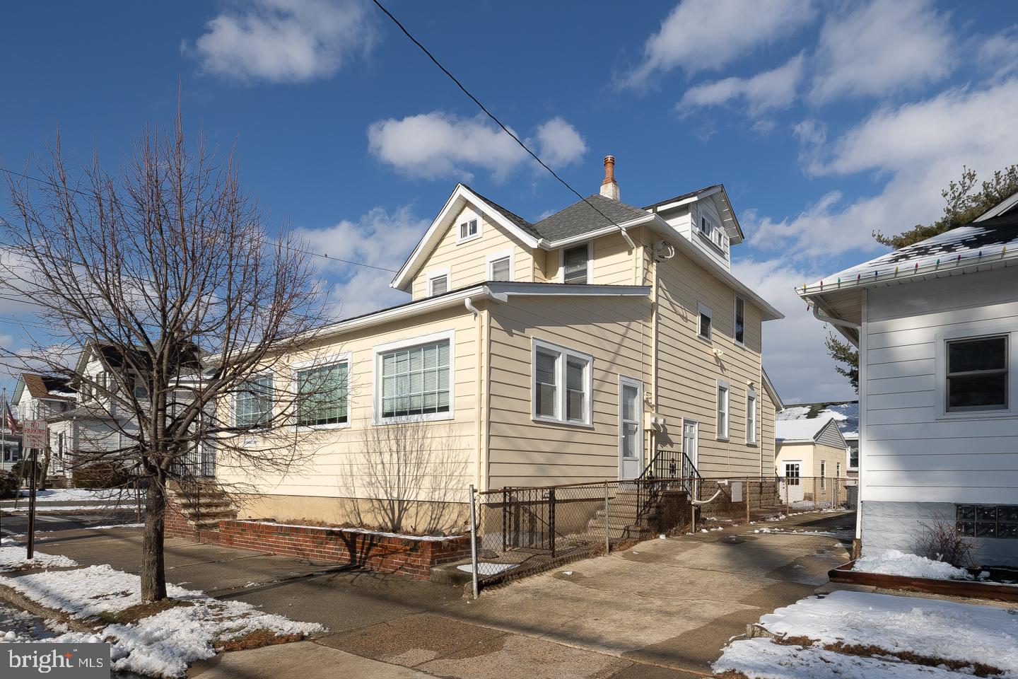 1017 Market Street Gloucester City, NJ 08030 - Photo 39 of 40 a front view of a house with a barbeque