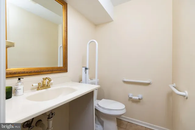 a bathroom with a sink toilet and vanity