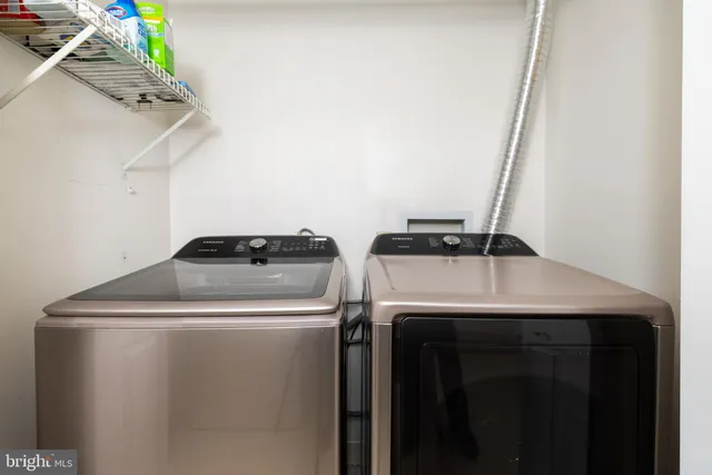 a utility room with dryer and washer