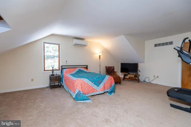 a room with furniture and a flat screen tv