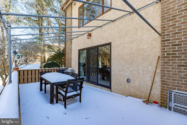 a view of a chairs and table in the patio