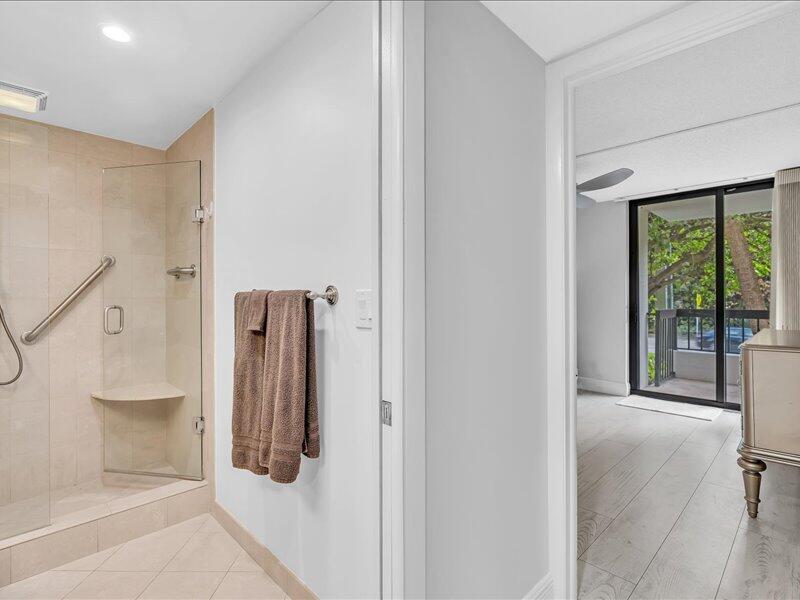 277 North Ocean Boulevard, Unit 102 Boca Raton, FL 33432 - Photo 29 of 53 a view of a hallway with windows and entryway