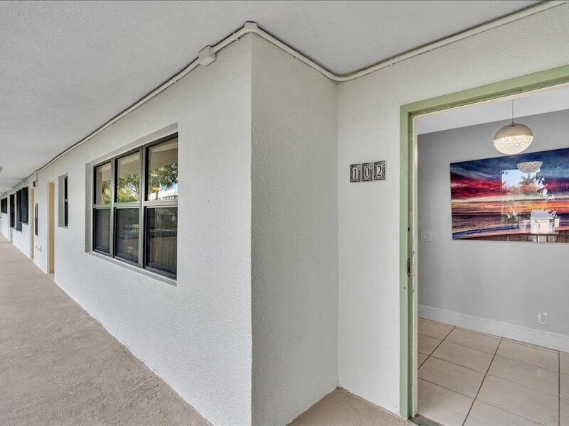 277 North Ocean Boulevard, Unit 102 Boca Raton, FL 33432 - Photo 47 of 53 a view of a hallway with front door