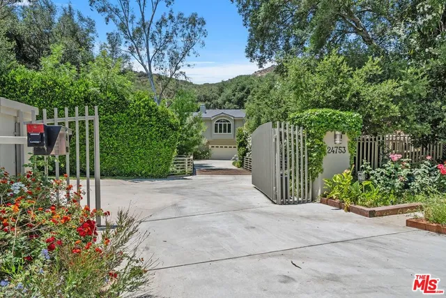 a view of a garden with potted plants