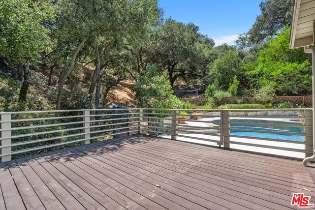 a view of outdoor space with deck and white umbrellas