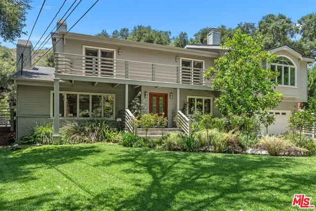 a house view with a garden space