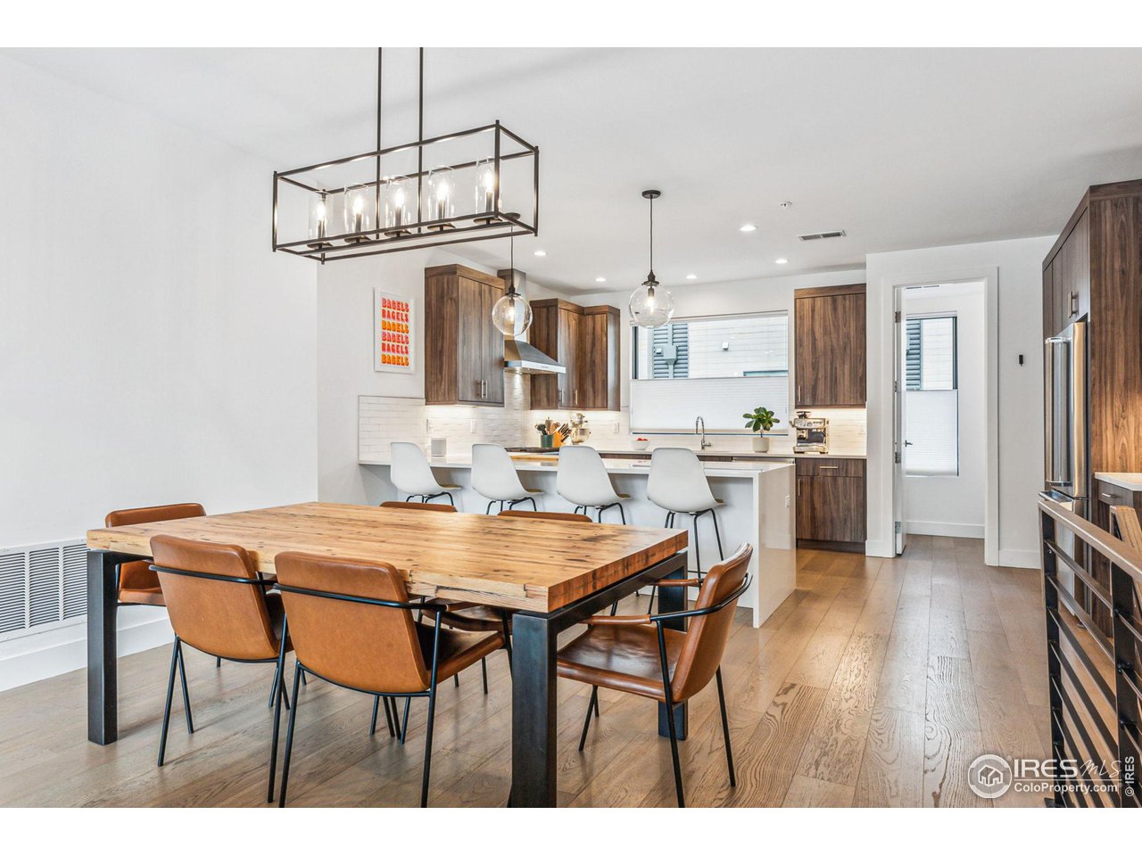 2471 Walnut Street Boulder, CO 80302 - Photo 13 of 36 a view of a dining room with furniture and wooden floor