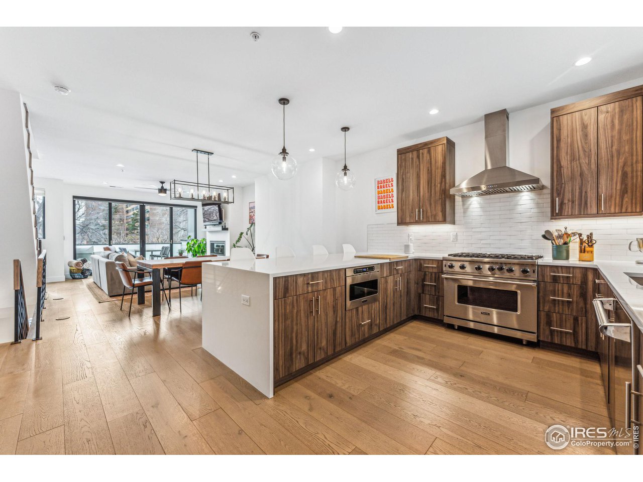 2471 Walnut Street Boulder, CO 80302 - Photo 14 of 36 a kitchen with stainless steel appliances a stove a sink a oven a dining table and chairs