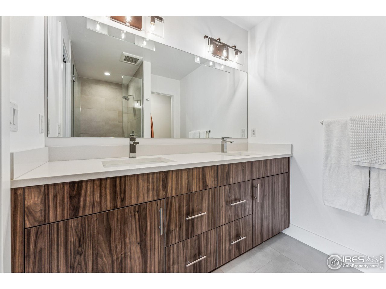 2471 Walnut Street Boulder, CO 80302 - Photo 24 of 36 a bathroom with a double vanity sink and a mirror
