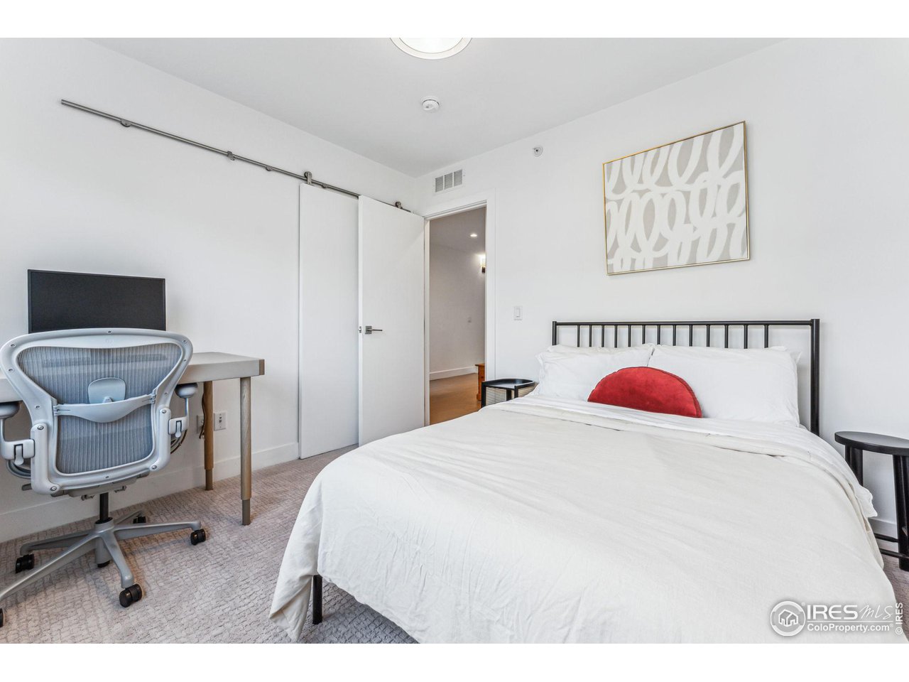 2471 Walnut Street Boulder, CO 80302 - Photo 26 of 36 a bedroom with a bed and a chair