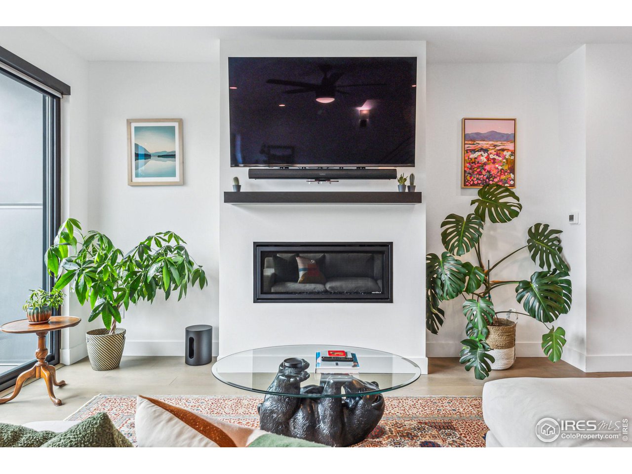 2471 Walnut Street Boulder, CO 80302 - Photo 9 of 36 a living room with furniture a potted plant and a fireplace