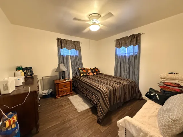 a bed room with a bed and dresser