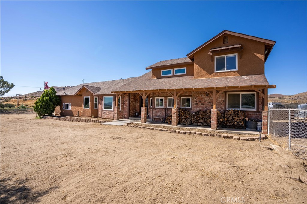 32828 El Sastre Road Acton, CA 93550 - Photo 1 of 1 a front view of a house with a yard